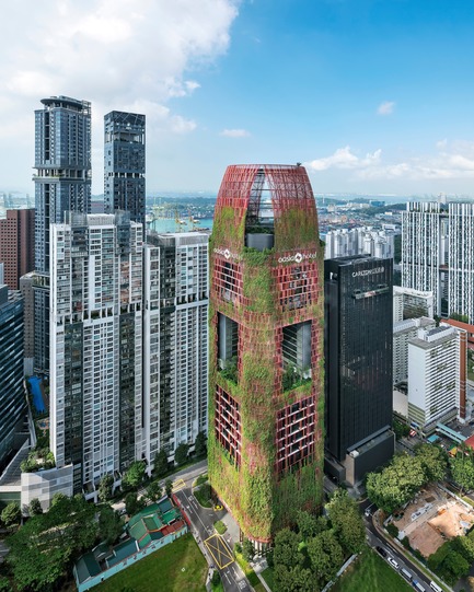 Press kit | 2506-04 - Press release | A Tropical Skyscraper by WOHA and Patricia Urquiola: Sustainability and Delight - AGROB BUCHTAL - Commercial Architecture - The red aluminium mesh will in time be covered by 21 different climbing plants and vines to form a sort of “vertical urban garden”. - Photo credit:  Infinitude 