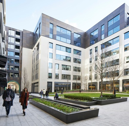 Press kit | 2317-01 - Press release | A New Oasis Off London’s Oxford Street - Make Architects - Residential Architecture - The commercial element has stainless steel spandrel panels to distinguish it from the residential element. The glazed ceramic bounces light around the garden while the dark bronze anodised aluminium links the commercial and residential elements together - Photo credit: Make Architects