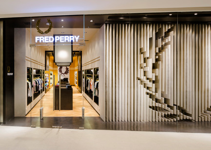 Press kit | 1124-08 - Press release | WIN Awards - Retail & Workspace Interiors Shortlist Announced - World Interiors News - Commercial Interior Design - WIN Awards 2016 - Retail Interiors Less Than 200 SQM Category: Fred Perry Bangkok by BuckleyGrayYeoman (United Kingdom) <br><br>BuckleyGrayYeoman were commissioned by Fred Perry to design their latest international store within the new EM Quartier Mall, in Bangkok, Thailand. The brief was to bring the brand's iconic English identity to an already culturally rich city within a unit providing 365 sq. m of retail space.<br><br>‘Fred Perry Bangkok has a very engaging shop front. It’s a very confident brand experience, and perfectly lifts the product for this market.’ SK <br><br>‘I think this is a great design. I particularly love the sculptural facade/window. The execution is very sophisticated. The clean lines and references really help to elevate the product.’ MM - Photo credit: BuckleyGrayYeoman 