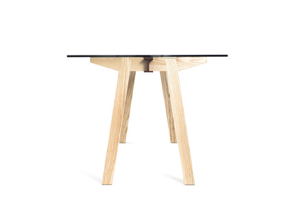 Press kit | 1124-12 - Press release | WIN Awards - Furniture and Surface & Interior Accessories Shortlists Announced - World Interiors News - Competition -   WIN Awards 2016 - Furniture Category: Joist Table by Daniel Schofield Design (London, United Kingdom)<br><br>The construction of Joist Table reflects the way timber floor joists fit into structural steelwork – the Ash legs fit into the beam and two bolts on the underside of the legs pull into each other through the beam, holding the structure together and giving it its strength. The glass then rests on top located on silicone pads to stop any movement.  &nbsp; <br><br> This allows for efficient shipping, easy assembly, great strength and a conservative use of materials whilst maintaining a clean and understandable construction narrative.  &nbsp;<br><br>  ‘A really clever, simple and scalable design that unusually adds something fresh to the world of tables. The constructional method leads into the design which is a nice touch as there is no conflict between how it’s made and how it looks. When those things come together it’s unusual and often leads to something becoming a classic.’ JT<br><br><br>   - Photo credit: Daniel Schofield Design&nbsp;