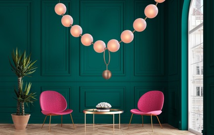 Press kit | 2110-05 - Press release | Inspired by legend, Coco by Larose Guyon illuminates with an air of sophistication - Larose Guyon - Lighting Design - Coco configuration in aged copper (standard finish) / ten 8'' hand blown glass shades, satin peach (custom finish) / 88’’ x 8’’ x 42’’ H - Photo credit: Larose Guyon