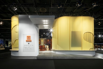 Press kit | 2704-05 - Press release | “Das Haus” 2019 at the imm cologne: Living by moods creates an appetite for open-plan homes - imm cologne 2019, Koelnmesse GmbH - Residential Interior Design - For Studio Truly Truly, who designed Das Haus 2019 for the international furniture and interiors fair imm cologne, contemporary living means a naturally flowing and organic interior. The camouflage pattern on the curtains surrounding Das Haus 2019 is a metaphor for the designer couple’s organic concept. - Photo credit: Constantin Meyer; Koelnmesse