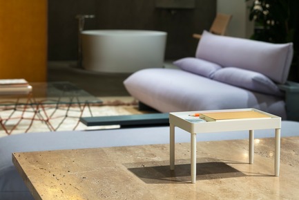 Press kit | 2704-05 - Press release | “Das Haus” 2019 at the imm cologne: Living by moods creates an appetite for open-plan homes - imm cologne 2019, Koelnmesse GmbH - Residential Interior Design - A view across the travertine tabletop (e15) from the Active zone into the Serene area of “Living by Moods”, the Das Haus installation at imm cologne 2019. The Press sofa is a prototype by guests of honour Studio Truly Truly, executed in ash and covered with Kvadrat’s Vidar fabric. - Photo credit: Constantin Meyer; Koelnmesse