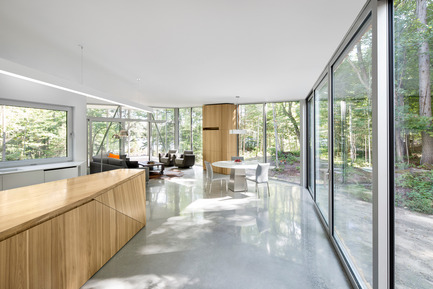 Press kit | 780-03 - Press release | House on Lac Grenier - Paul Bernier Architecte - Residential Architecture -         Kitchen island, glass wall, and view toward   living area       - Photo credit: Adrien Williams